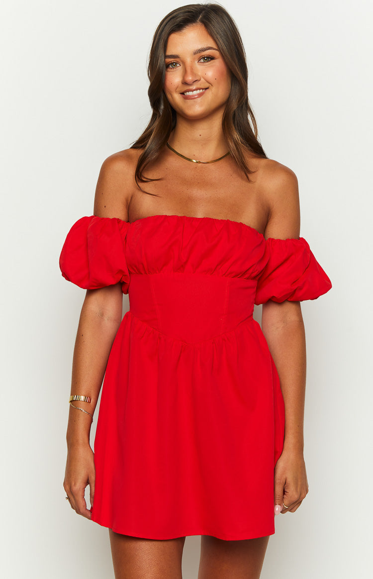 Side view of a red off-the-shoulder mini dress with elasticated puffed sleeves and a gathered waist
