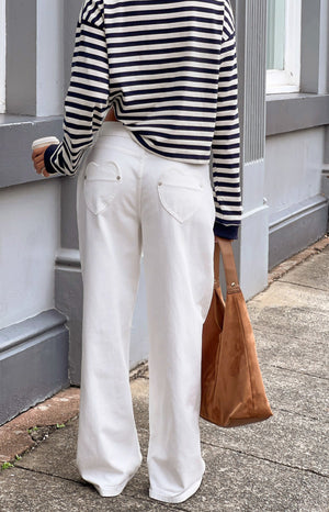 Beginning Boutique Lovers Lane White Denim Heart Pocket Slouchy Jeans white denim slouchy wide-leg jeans with heart-shaped ba