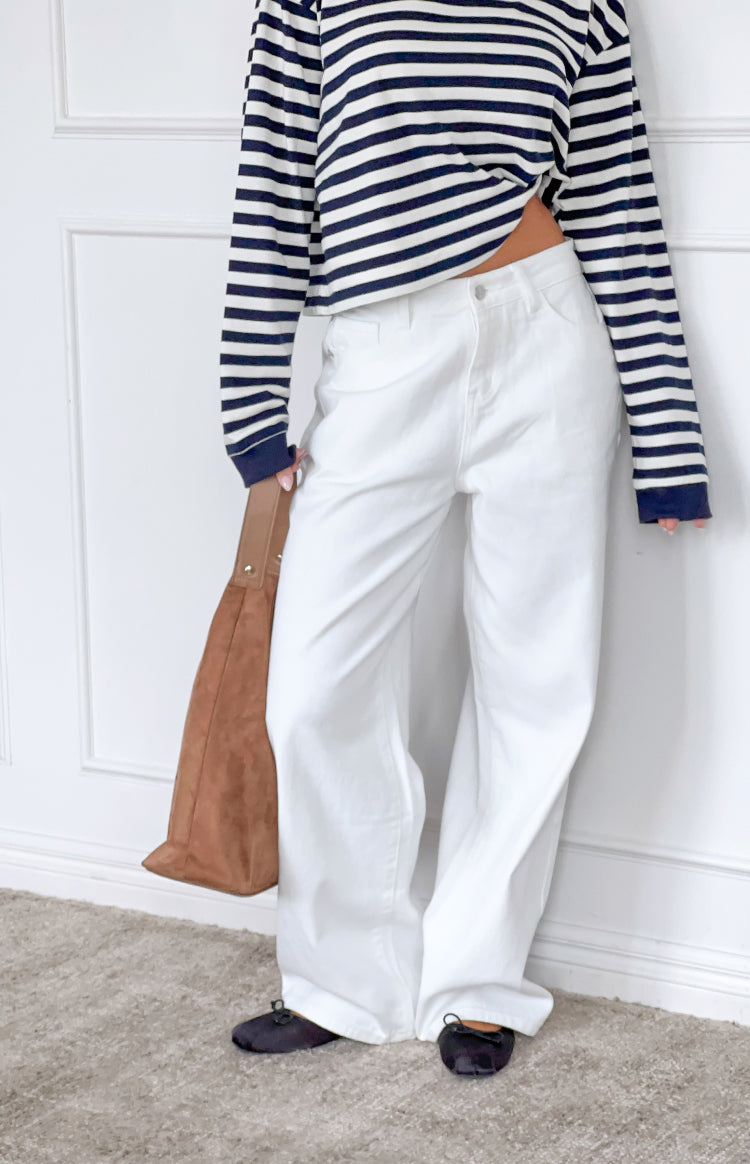 Front view of white denim slouchy jeans with a wide leg and relaxed fit