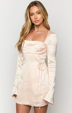 Close-up of the cream satin mini dress showing the square neckline, ruched bust, and side drawstring detail