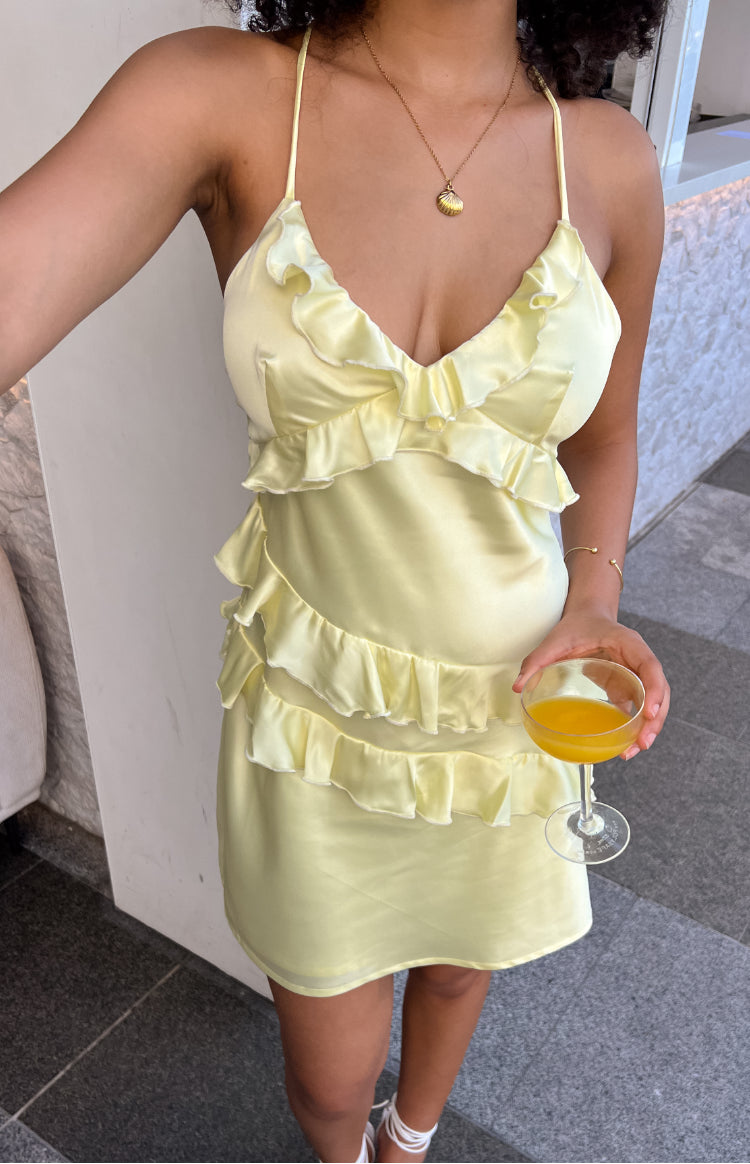 Beginning Boutique Lydia Yellow Mini Dress light yellow satin mini dress with V-neck, spaghetti straps, and tiered ruffles