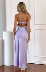 Rear view of a lilac satin maxi dress with a strapless shirred back band and draped open back