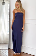 Navy strapless maxi dress with a structured bandeau neckline and a long flowing skirt