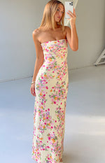 Yellow floral strapless maxi dress with a fitted bodice and flowing skirt