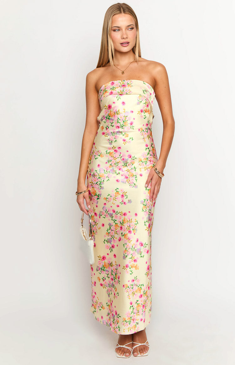 Front view of a yellow floral strapless maxi dress with a straight neckline and a fitted silhouette