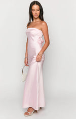 Side view of a light pink strapless satin maxi dress with a subtle bow detail at the back