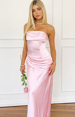 Pink satin strapless maxi dress with draped neckline, corset bodice, and ruched hip detail
