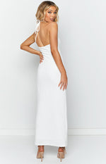 Rear-side view of a white textured maxi dress with a halter neck tie and open back