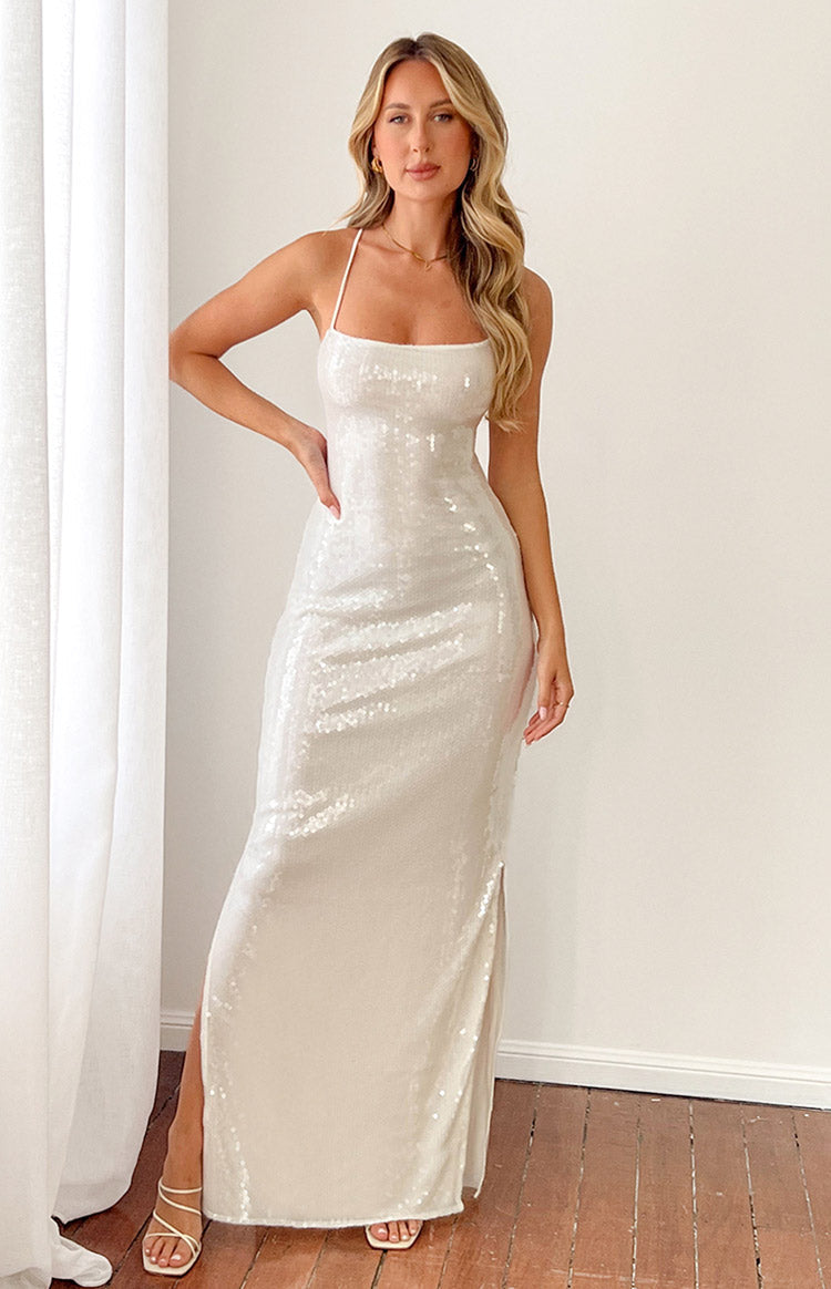 Full length white sequin slip maxi dress with a square neckline, thin spaghetti straps, and a high side slit