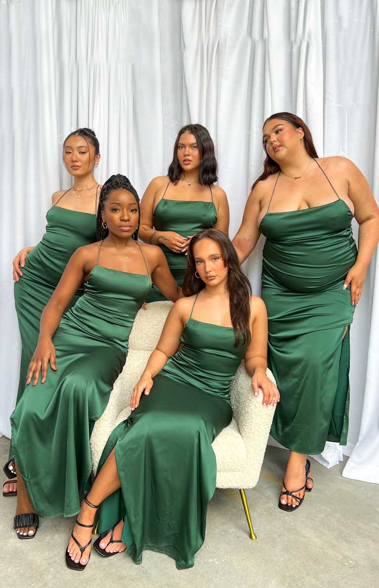 Emerald green satin maxi slip dresses with straight necklines, delicate spaghetti straps, and high side slits