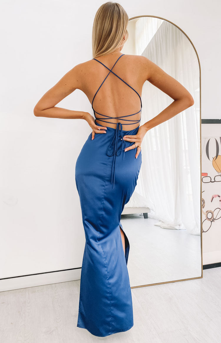 Navy satin formal dress with criss-cross tie-back straps and a long side split