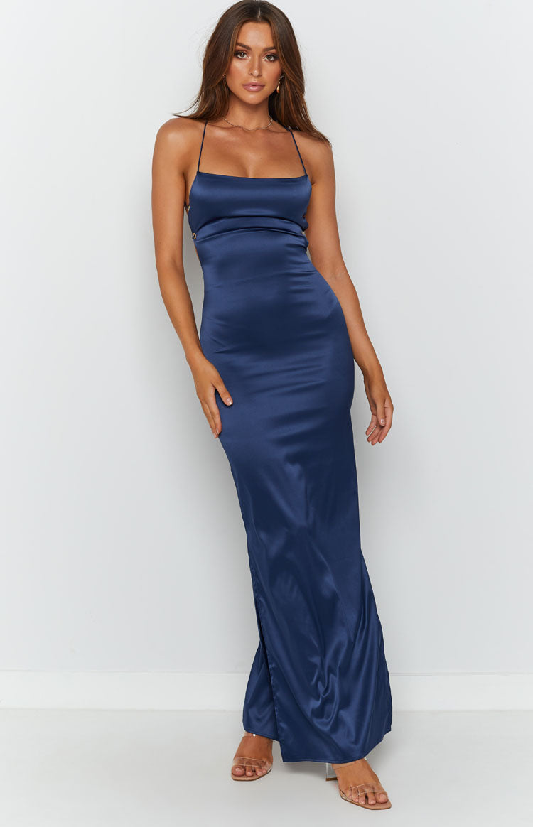 Midnight blue satin maxi dress with a draped cowl neckline, thin straps, and a high side slit