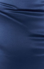 Close up of midnight blue satin fabric with a smooth texture and subtle sheen