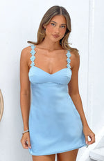 Front view of a blue satin mini dress with a sweetheart neckline and floral applique straps