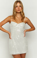 White sequin mini dress on brunette model