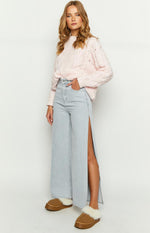 Light denim wide leg jeans with a high waist and long side splits on both legs