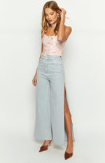 Full length view of light wash wide leg denim jeans with high side splits on both outer seams