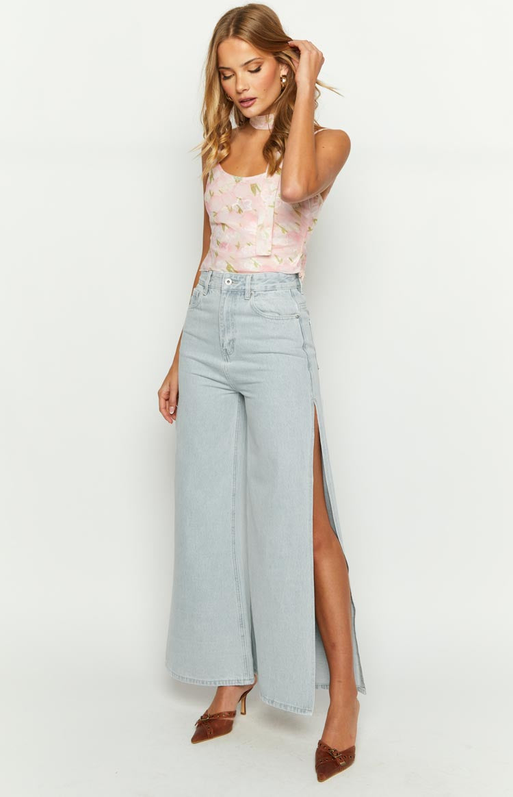 Full length view of light wash wide leg denim jeans with high side splits on both outer seams