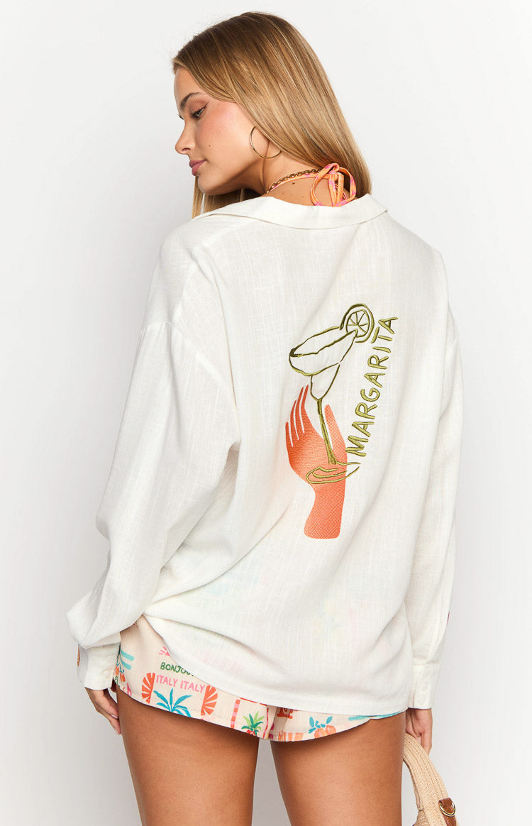 Rear view of the white long sleeve shirt with a graphic print of a hand holding a margarita glass and 'MARGARITA' text