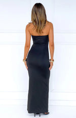 Rear view of a black strapless maxi dress with a fitted silhouette