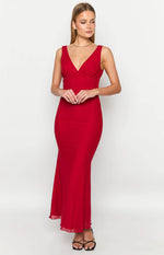 Red sleeveless maxi dress with a deep V-neckline, gathered bodice, and sheer hem
