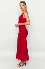 Side view of a red maxi dress with a ruched V-neckline, fitted bodice, and flowy skirt with a sheer hem