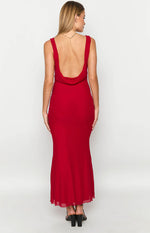 Rear view of a red maxi dress with a low draped cowl back and flowing skirt