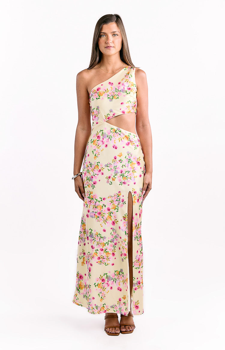 Yellow floral satin maxi dress with a one-shoulder design, side waist cutouts, and a high thigh split