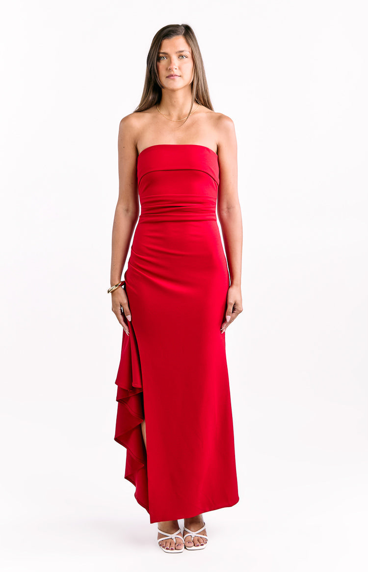 Red strapless crepe maxi dress with a fitted ruched bodice and a tiered ruffle detail on the left side