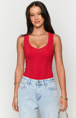 Front view of a red lace V-neck sleeveless bodysuit, highlighting the intricate floral lace pattern