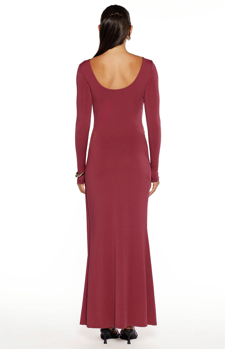 Back view of the burgundy long sleeve maxi dress with a deep scoop back and a relaxed, flowing skirt