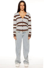 Front view of a brown and blue stripe button down cardigan worn open, showing its relaxed fit