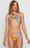 Vibrant multi-coloured floral wrap-around halter neck top with a front cut-out