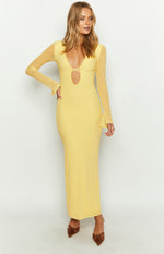 Yellow bodycon maxi dress with a deep V-neck, bust cutout, and sheer long sleeves with flared cuffs