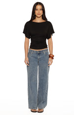Black jersey top with a wide boat neck, dolman short sleeves, and a fitted ruched waist