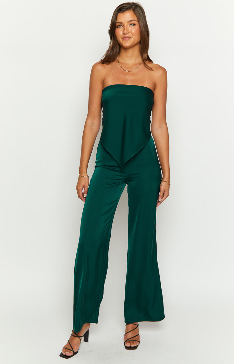 Full length view of teal wide-leg pants with a high-waisted fit and a flowing, lustrous fabric