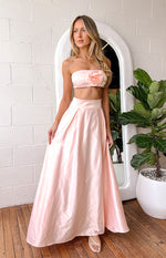 Front view of the pink satin high waisted maxi skirt showing its full length and elegant drape