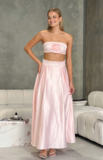 Full front view of a flowy pink satin high-waisted maxi skirt with pleats