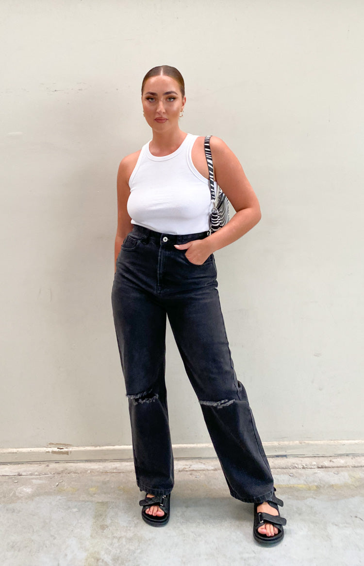 White ribbed knit tank top with a high crew neckline and a fitted silhouette