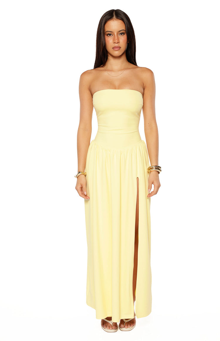 Yellow strapless maxi dress with a fitted bodice, gathered waist, and high side split