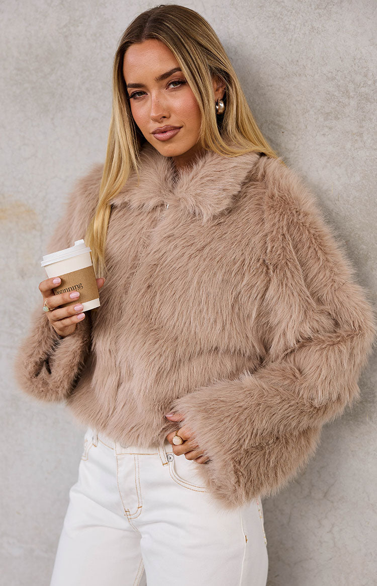 Textured light brown faux fur jacket with a wide collar and long sleeves with flared cuffs