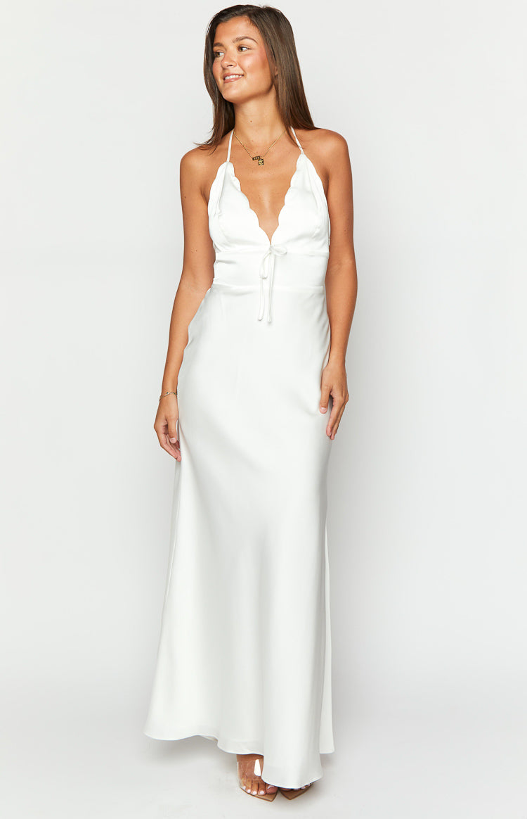 White satin maxi dress with a scalloped halter neckline and a drawstring tie at the bust