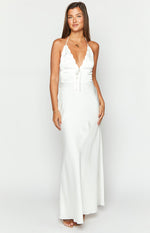 White satin maxi dress with a scalloped halter neckline and tie-front ruched bust