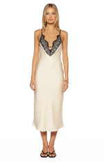 Front view of a cream satin midi dress with a deep V-neckline and black floral lace trim
