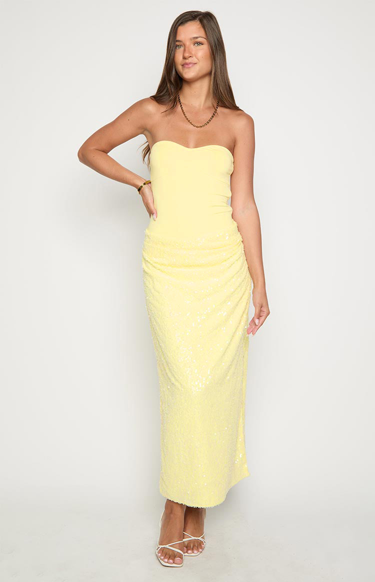 Yellow strapless maxi dress with a plain fitted bodice and a ruched sequin skirt
