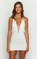 Beginning Boutique Novalie Mini White Dress white textured mini dress with a halter deep V-neck and tie-front detail