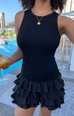Beginning Boutique Oh My Black Playsuit black ribbed knit sleeveless playsuit with tiered ruffled shorts