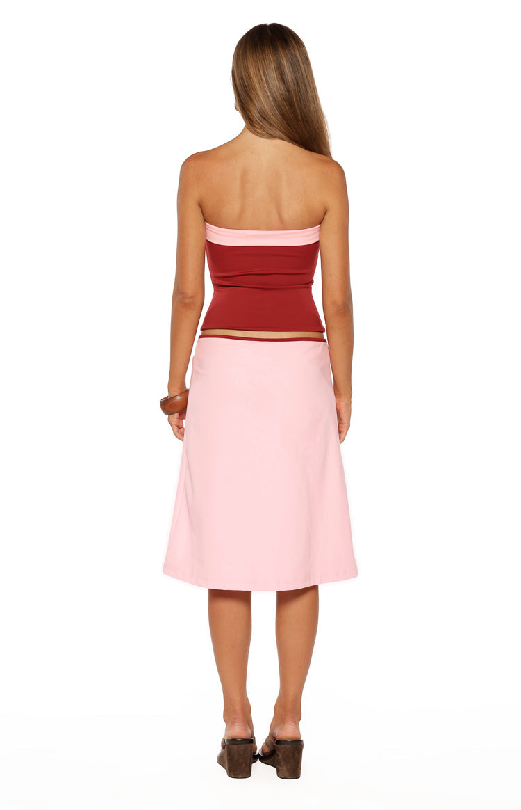 Rear view of the stra strapless dark red top with light pink contrast bands at the top and bottom hem