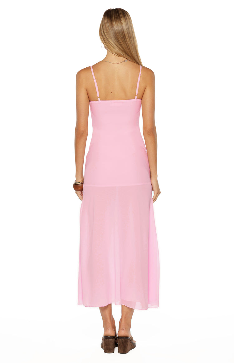 Rear view of the light pink midi dress showing the square back, adjustable spaghetti straps, and sheer overlay skirt