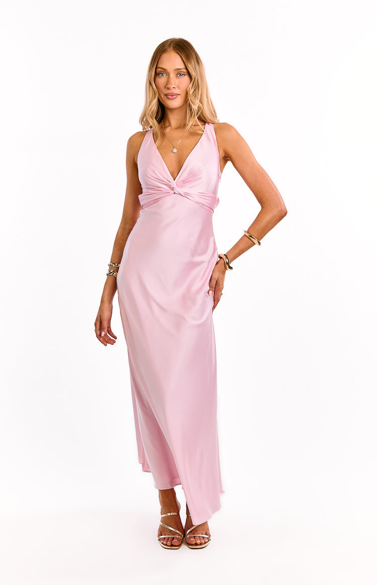Front view of a light pink satin maxi dress featuring a deep V-neck and twisted knot bodice